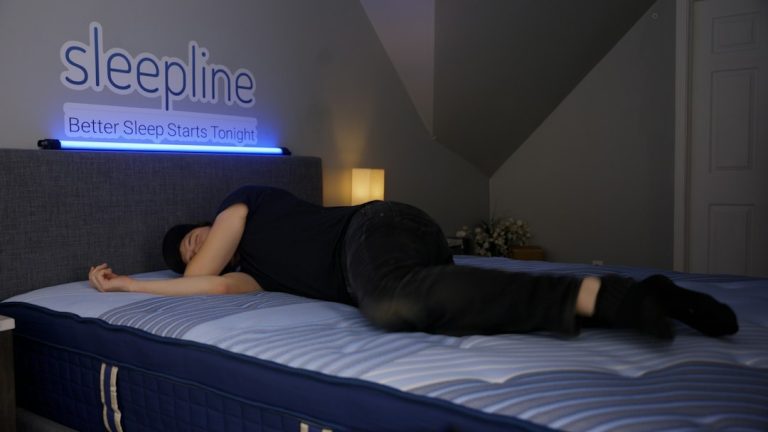 Person sleeping on their side on a mattress