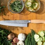 sliced vegetables and meat on chopping board