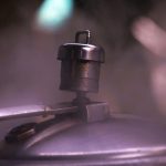 A close up of a metal object with a blurry background
