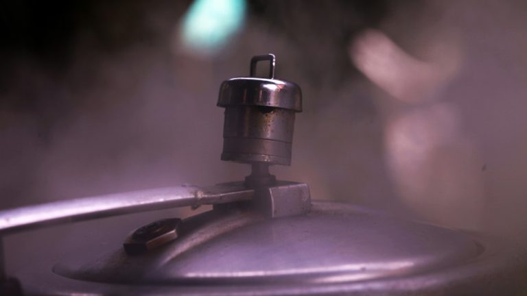 A close up of a metal object with a blurry background